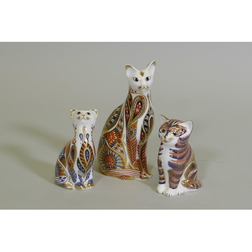 9 - A Royal Crown Derby cat, 13cm high, and two others