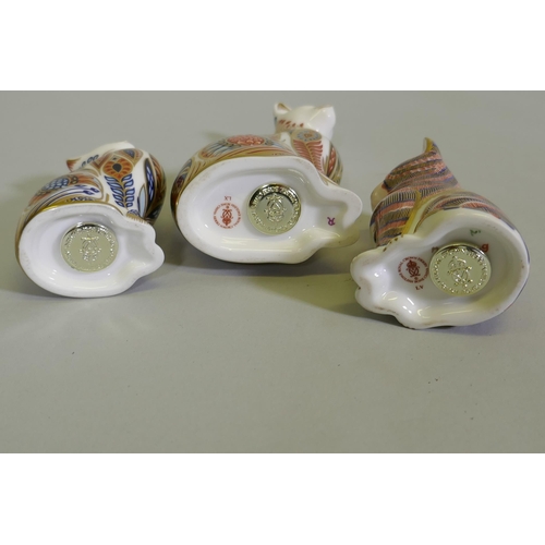 9 - A Royal Crown Derby cat, 13cm high, and two others