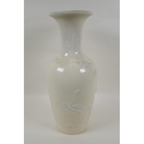 90 - A C19th Chinese blanc de chine porcelain vase, with raised decoration of deer and crane in a landsca... 