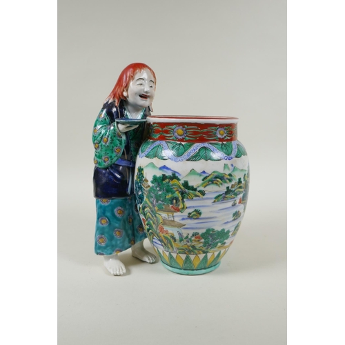 95 - A Japanese Kutani porcelain vase with a figure, the vase decorated with a riverside landscape, marke... 