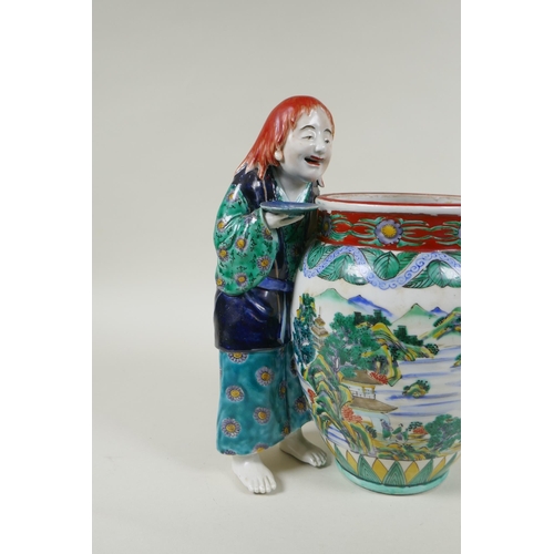 95 - A Japanese Kutani porcelain vase with a figure, the vase decorated with a riverside landscape, marke... 