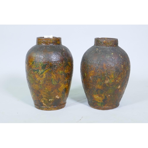 10 - A pair of C19th terracotta jars with decoupage scrapwork decoration, 30cm high