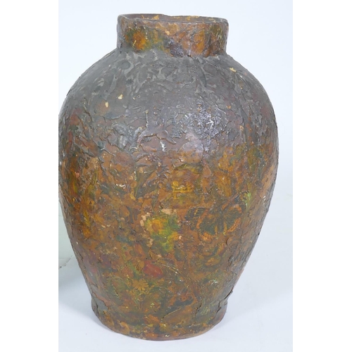 10 - A pair of C19th terracotta jars with decoupage scrapwork decoration, 30cm high