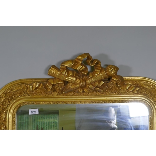 1009 - A C19th French giltwood and composition wall mirror with carved crest and original glass, 79 x 116cm