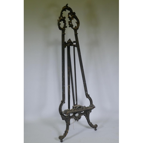 1011 - A C19th French carved and painted wood artist's easel, decorated with swags and flowers, AF losses, ... 