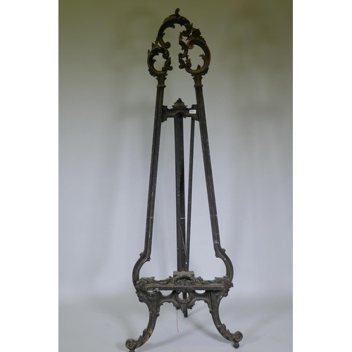 1011 - A C19th French carved and painted wood artist's easel, decorated with swags and flowers, AF losses, ... 