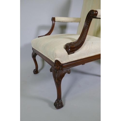 1012 - A pr of C18th style Gainsborough chairs with carved decoration and hump backs, raised on cabriole su... 