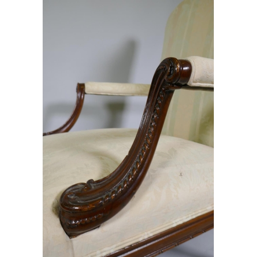 1012 - A pr of C18th style Gainsborough chairs with carved decoration and hump backs, raised on cabriole su... 