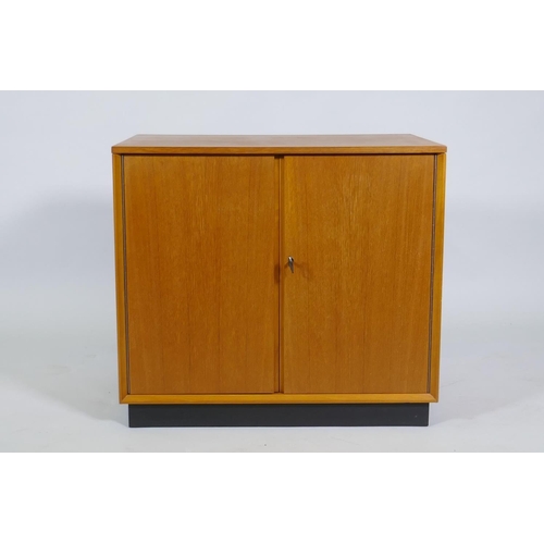 1016 - A mid-century Dynatron teak music cabinet with two doors and record dividers, 61 x 43 x 54cm