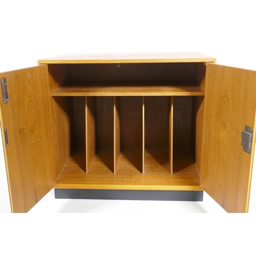 1016 - A mid-century Dynatron teak music cabinet with two doors and record dividers, 61 x 43 x 54cm