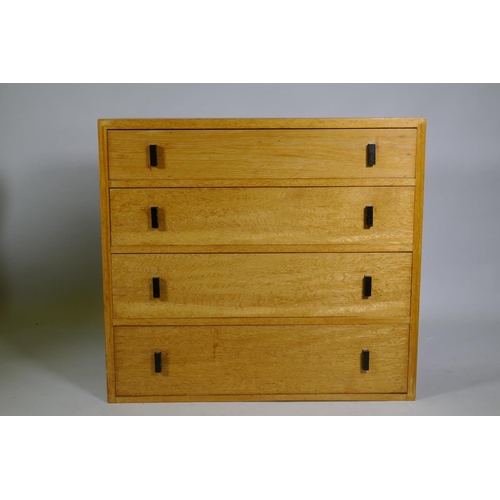 1019 - A mid-century oak chest of four long drawers, 92 x 43 x 83cm