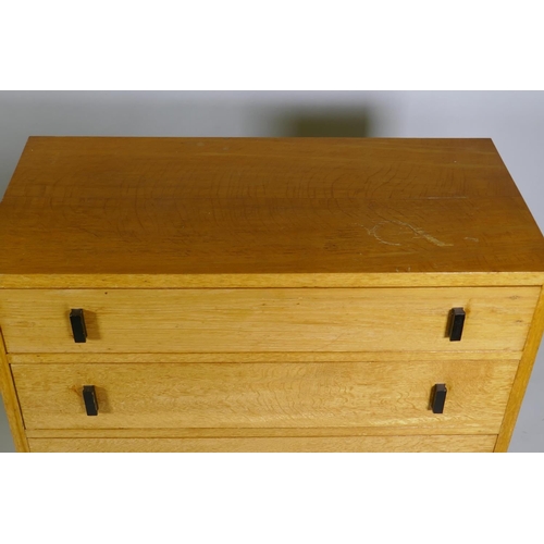 1019 - A mid-century oak chest of four long drawers, 92 x 43 x 83cm