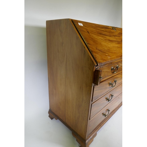 1022 - A Georgian mahogany bureau, the fall front with inset leather opening to reveal a fitted interior wi... 