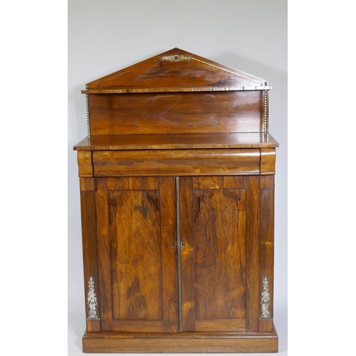 1023 - A small Regency rosewood chiffonier with brass stringing and mounts, the upper shelf raised on twist... 