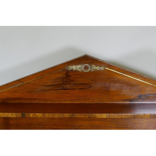 1023 - A small Regency rosewood chiffonier with brass stringing and mounts, the upper shelf raised on twist... 