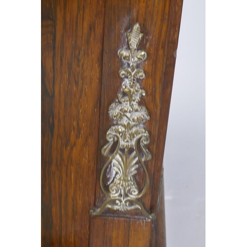 1023 - A small Regency rosewood chiffonier with brass stringing and mounts, the upper shelf raised on twist... 