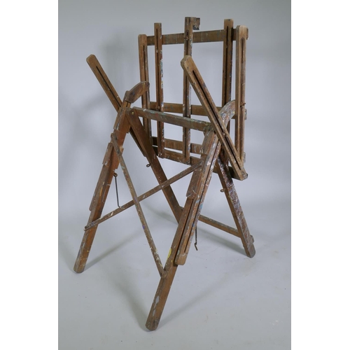 1025 - A well used wooden folding artist's easel, 62cm wide