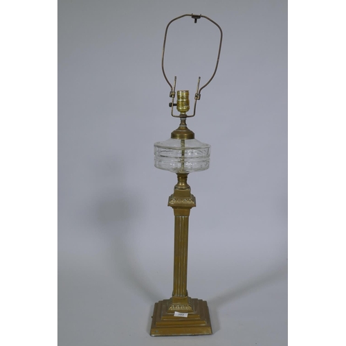 103 - A Victorian brass oil lamp with cut glass reservoir, converted to electricity, 88cm high