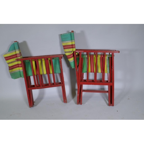 1030 - A pair of vintage campaign style folding deckchairs