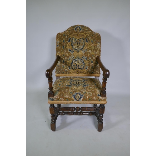 1033 - A C17th William and Mary walnut humpback open armchair on turned supports, circa 1690, historic repa... 