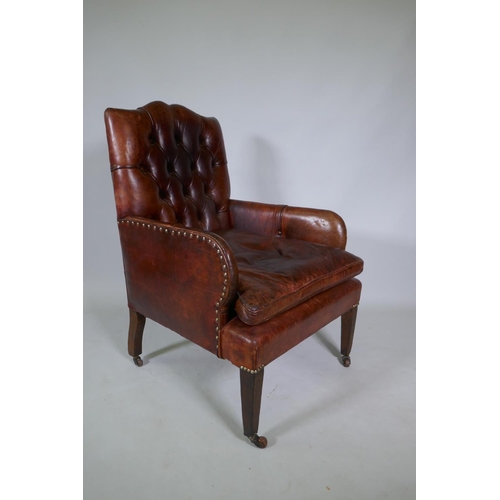 1034 - A Cornelius V Smith small Victorian button back leather armchair, stamped CVS, AF