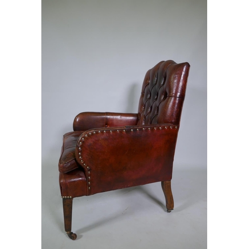 1034 - A Cornelius V Smith small Victorian button back leather armchair, stamped CVS, AF