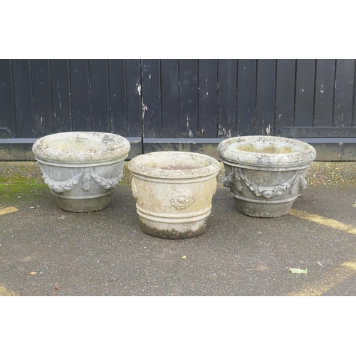 1037 - A pair of concrete garden planters, 50 x 36cm, and another