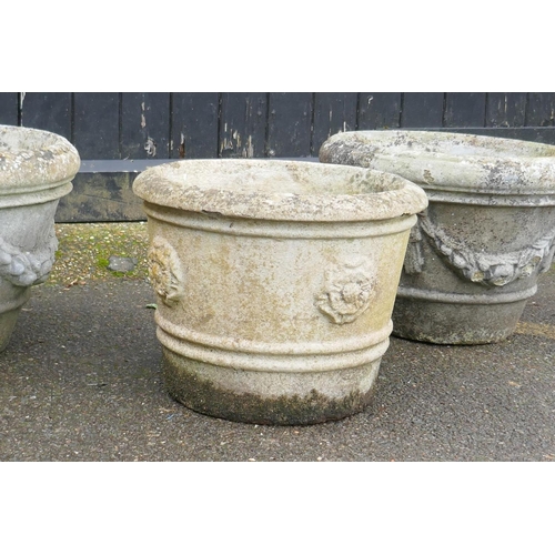 1037 - A pair of concrete garden planters, 50 x 36cm, and another