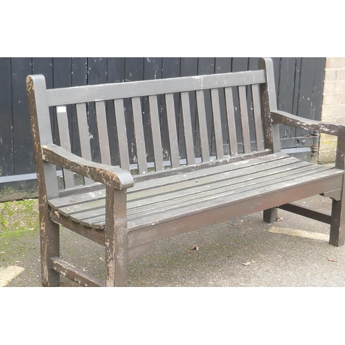 1044 - A varnished teak garden bench, 150cm wide