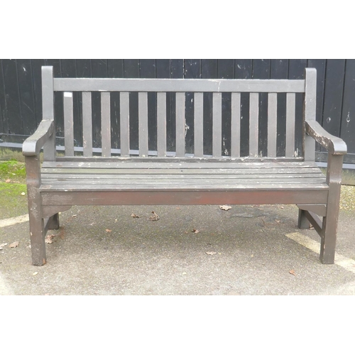 1044 - A varnished teak garden bench, 150cm wide