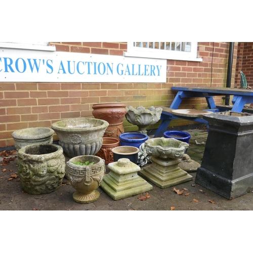 1046 - A quantity of terracotta and concrete garden planters, a chimney pot/pedestal, 53cm high, etc