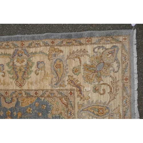 1048 - A Persian pewter ground Sarouk Farahan carpet with an all over floral design and gold borders, 360 x... 