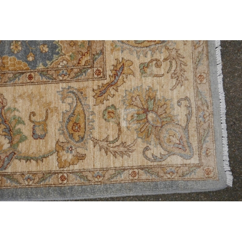 1048 - A Persian pewter ground Sarouk Farahan carpet with an all over floral design and gold borders, 360 x... 