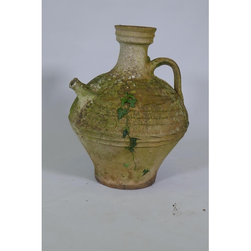 1049 - A terracotta oil jar, 54cm high