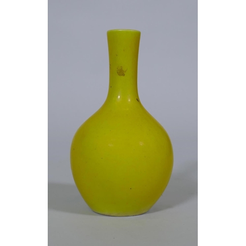 105 - A Chinese famille jaune glazed bottle shaped vase, seal mark to base, 18cm high