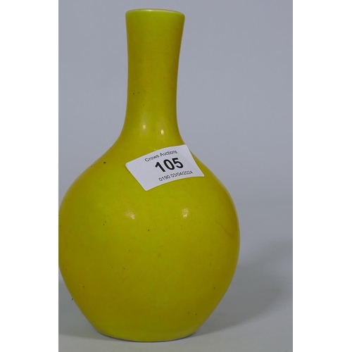 105 - A Chinese famille jaune glazed bottle shaped vase, seal mark to base, 18cm high