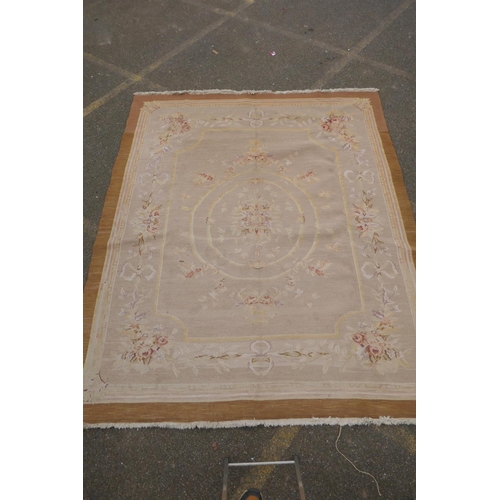 1053 - An antique French beige ground wool Savonnerie rug, 242 x 296cm