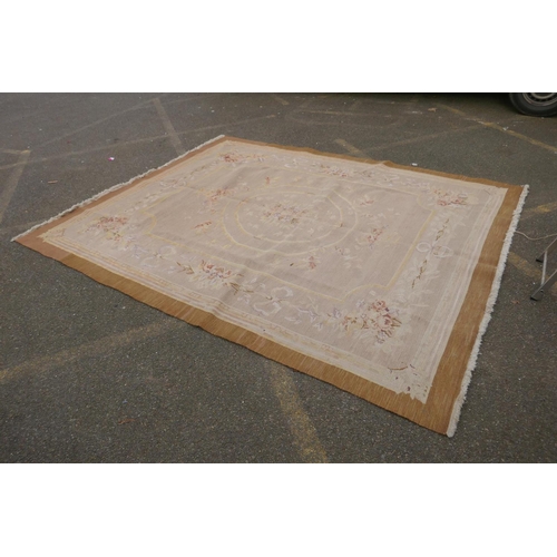 1053 - An antique French beige ground wool Savonnerie rug, 242 x 296cm