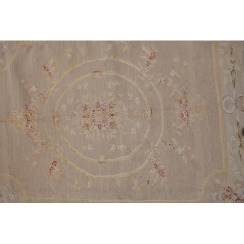 1053 - An antique French beige ground wool Savonnerie rug, 242 x 296cm