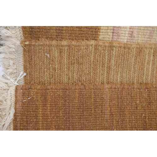 1053 - An antique French beige ground wool Savonnerie rug, 242 x 296cm