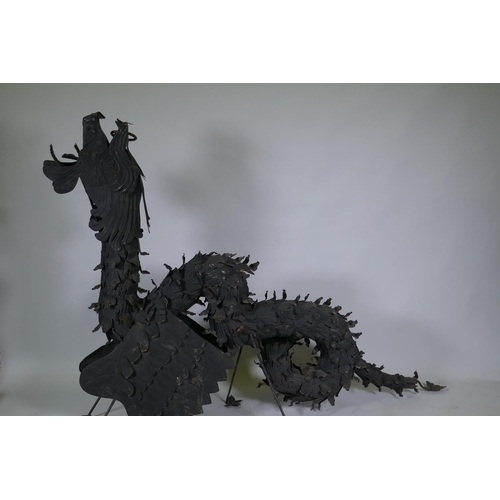 1057 - A pair of metal wall brackets in the form of dragons, 170 x 128cm, (associated with previous lot)