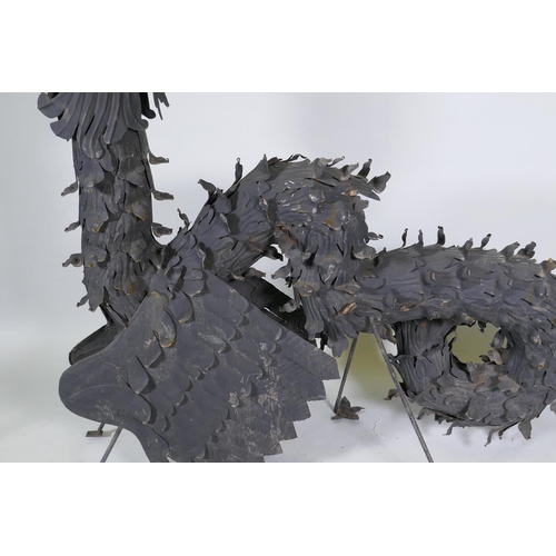 1057 - A pair of metal wall brackets in the form of dragons, 170 x 128cm, (associated with previous lot)