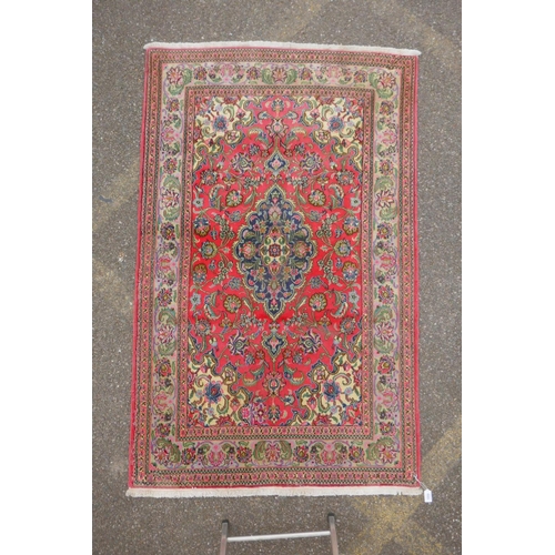 1059 - A very fine hand woven Persian Kashan rug with floral medallion design on a pink field, patched, 172... 