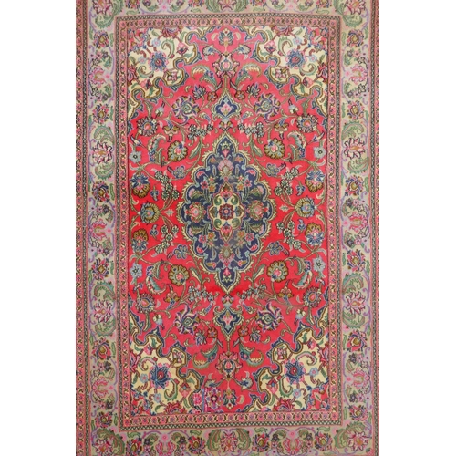 1059 - A very fine hand woven Persian Kashan rug with floral medallion design on a pink field, patched, 172... 