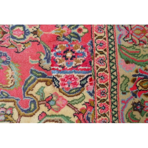 1059 - A very fine hand woven Persian Kashan rug with floral medallion design on a pink field, patched, 172... 