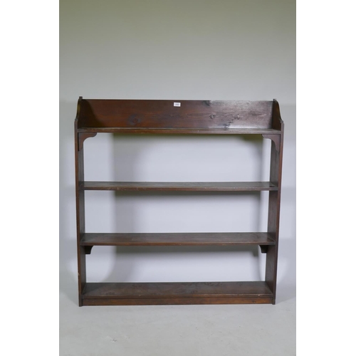 1060 - A vintage stained pine open bookshelf, 118 x 21 x 123cm