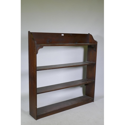 1060 - A vintage stained pine open bookshelf, 118 x 21 x 123cm