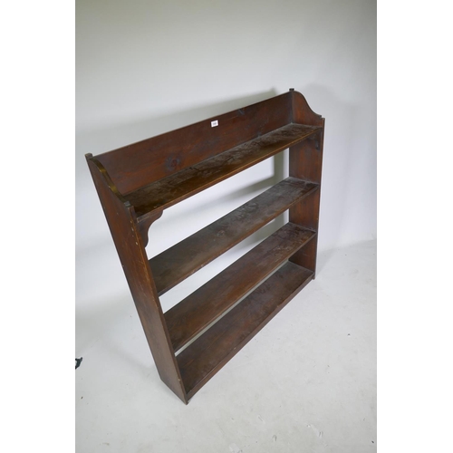 1060 - A vintage stained pine open bookshelf, 118 x 21 x 123cm