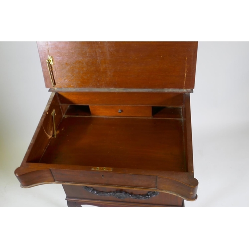 1062 - A Victorian mahogany Davenport, lift up top with fitted interior, fall front and three true and thre... 