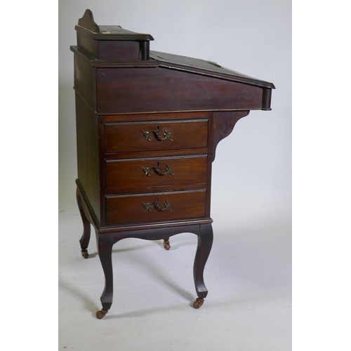 1062 - A Victorian mahogany Davenport, lift up top with fitted interior, fall front and three true and thre... 